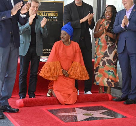 Five-time Grammy-winning Beninese musician, actress, and activist Angelique Kidjo reacts during an unveiling ceremony honoring her with the 2,854th star on the Hollywood Walk of Fame in Los Angeles on Tuesday, August 18, 2026.  LAP2026081809 JIMxRUYMEN