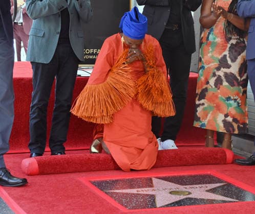 Five-time Grammy-winning Beninese musician, actress, and activist Angelique Kidjo reacts during an unveiling ceremony honoring her with the 2,854th star on the Hollywood Walk of Fame in Los Angeles on Tuesday, August 18, 2026.  LAP2026081810 JIMxRUYMEN