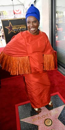 Five-time Grammy-winning Beninese musician, actress, and activist Angelique Kidjo stands on her star during an unveiling ceremony honoring her with the 2,854th star on the Hollywood Walk of Fame in Los Angeles on Tuesday, August 18, 2026.  LAP2026081816 JIMxRUYMEN