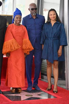 Five-time Grammy-winning Beninese musician, actress, and activist Angelique Kidjo is joined actor Djimon Hounsou (C) and her daughter Naima Herbrail Kidjo during an unveiling ceremony honoring her with the 2,854th star on the Hollywood Walk of Fame in Los Angeles on Tuesday, August 18, 2026.  LAP2026081827 JIMxRUYMEN