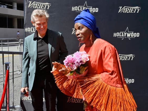 Five-time Grammy-winning Beninese musician, actress, and activist Angelique Kidjo is joined by actor Willem Dafoe (L) looks on during an unveiling ceremony honoring her with the 2,854th star on the Hollywood Walk of Fame in Los Angeles on Tuesday, August 18, 2026.  LAP2026081829 JIMxRUYMEN