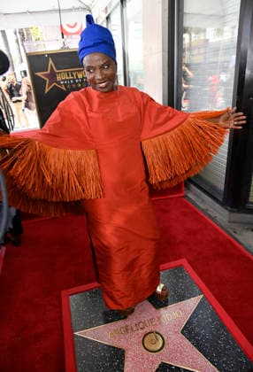 Five-time Grammy-winning Beninese musician, actress, and activist Angelique Kidjo stands on her star during an unveiling ceremony honoring her with the 2,854th star on the Hollywood Walk of Fame in Los Angeles on Tuesday, August 18, 2026.  LAP2026081833 JIMxRUYMEN