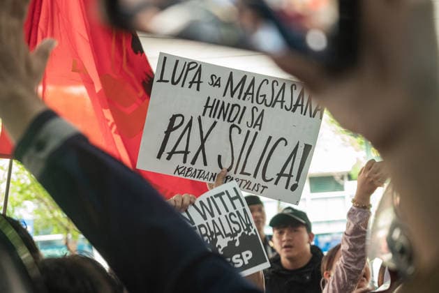 August 19, 2026, Quezon City, Quezon, Philippines: A protest made up of youth groups and progressive sectoral groups marched along the streets of Bonifacio Global City toward the headquarters of the BCDA to reject the proposed Pax Silica. Quezon City Philippines - ZUMAy102 20260819_zip_y102_008 Copyright: xKenosisxYapx