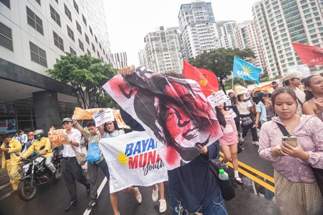 August 19, 2026, Quezon City, Quezon, Philippines: A protest made up of youth groups and progressive sectoral groups marched along the streets of Bonifacio Global City toward the headquarters of the BCDA to reject the proposed Pax Silica. Quezon City Philippines - ZUMAy102 20260819_zip_y102_019 Copyright: xKenosisxYapx