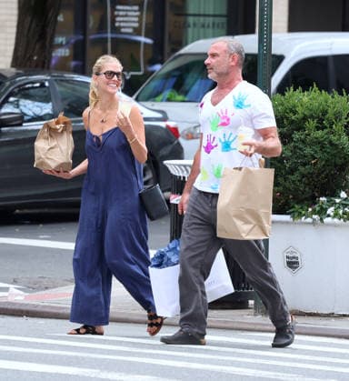 Liev Schreiber With His Wife Out in NYC Actor Liev Schreiber with a funny hand painted tshirt is walking with his wife Taylor Neisen in Soho, New York on August 18, 2026. Photo by Dylan Travis ABACAPRESS.COM New York City New York United States  Copyright: xDylanxTravis ABACAx