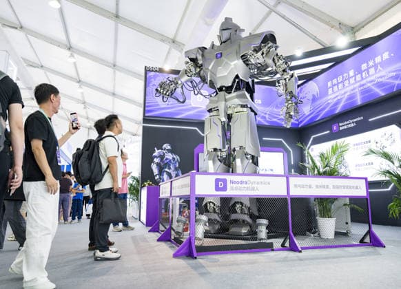 BEIJING, CHINA - AUGUST 19: Visitors look at a four-meter-tall robot during the opening of the 2026 World Robot Conference on August 19, 2026 in Beijing, China. The World Robot Conference 2026 kicks off in Beijing on August 19, bringing together leading robotics companies, experts and innovators from around the world. The event showcases the latest advances and applications across the robotics industry, from humanoid robots and embodied intelligence to cutting-edge components and real-world solutions.  Copyright: xChinaxNewsxServicex 111660848576