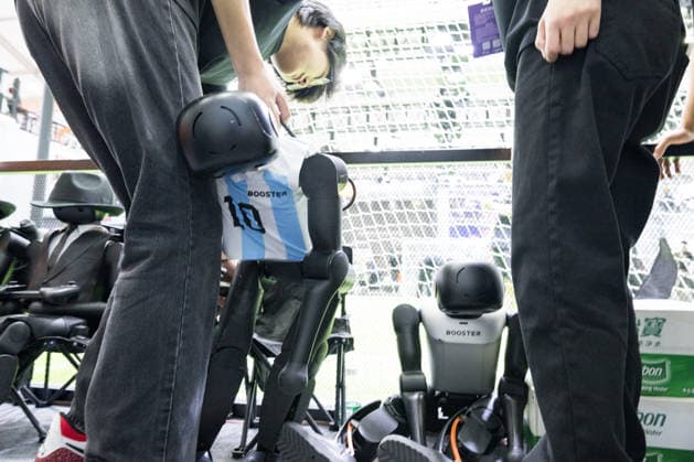 BEIJING, CHINA - AUGUST 19: A staff member changes the battery for a soccer robot during the 2026 World Robot Conference on August 19, 2026 in Beijing, China. The World Robot Conference 2026 kicks off in Beijing on August 19, bringing together leading robotics companies, experts and innovators from around the world. The event showcases the latest advances and applications across the robotics industry, from humanoid robots and embodied intelligence to cutting-edge components and real-world solutions.  Copyright: xChinaxNewsxServicex 111660848577