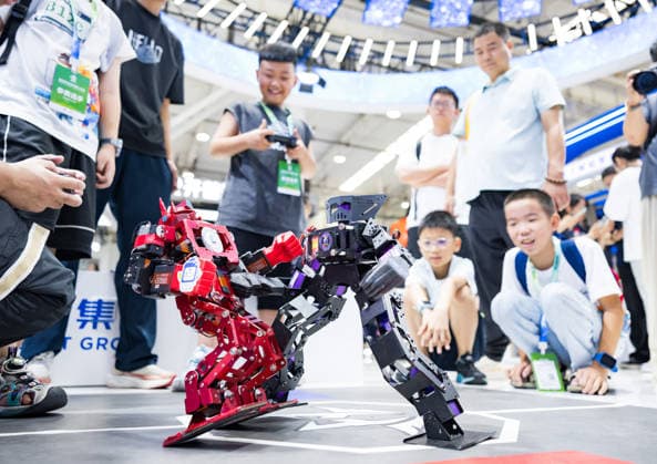 BEIJING, CHINA - AUGUST 19: A child watches a mecha fighting robot during the opening of the 2026 World Robot Conference on August 19, 2026 in Beijing, China. The World Robot Conference 2026 kicks off in Beijing on August 19, bringing together leading robotics companies, experts and innovators from around the world. The event showcases the latest advances and applications across the robotics industry, from humanoid robots and embodied intelligence to cutting-edge components and real-world solutions.  Copyright: xChinaxNewsxServicex 111660848396