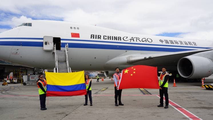 (260819) -- BOGOTA, Aug. 19, 2026 -- Staff members pose for photos with the national flags of China and Colombia upon the arrival of humanitarian earthquake relief supplies provided by the Chinese government at an airport in Bogota, Colombia, Aug. 18, 2026. Humanitarian earthquake relief supplies provided by the Chinese government arrived in Bogota on Tuesday to support Colombia s disaster response and post-disaster reconstruction efforts. ) COLOMBIA-BOGOTA-CHINA-EARTHQUAKE RELIEF ASSISTANCE-ARRIVAL LixZijian 
