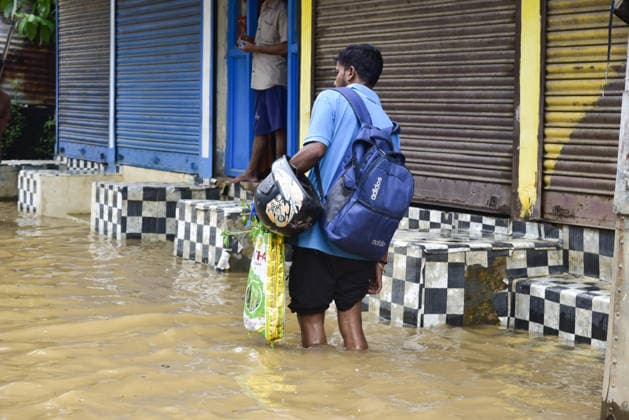 Heavy rainfall in India s Guwahati GUWAHATI, INDIA - AUGUST 19: A man with his trousers rolled up above his knees is walking along a street filled with floodwaters following heavy rainfall in Guwahati, Assam state, India, on August 19, 2026. The severe monsoon downpour triggered widespread flash flooding and waterlogging across multiple neighborhoods, disrupting normal life and forcing residents to use makeshift watercraft and boats for daily transportation. Hafiz Ahmed Anadolu Guwahati India. Editorial use only. Please get in touch for any other usage.  Copyright: x2026xAnadoluxHafizxAhmedx