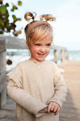 Cute toddler girl with messy pigtails smiles at the beach Cocoa Beach, Florida, United States CR_AKAO260818B-2105513-01 ,model released, Symbolfoto ,property released