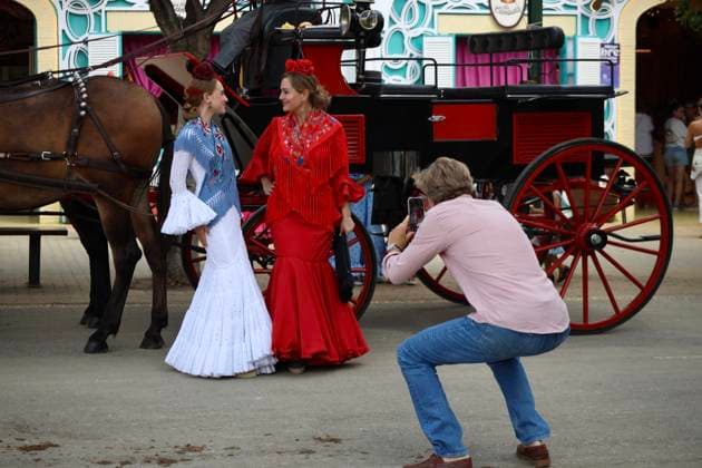Scenes from the Málaga Fair: Several women dressed in flamenco outfits stroll through the Málaga Fair on August 19, 2026, in Málaga, Andalusia, Spain As they do every year, locals and visitors enjoy the Málaga Fair at the fairgrounds August 19, 2026, in Málaga, Andalusia, Málaga, Andalusia, Spain  Copyright: xÃlexxZeax 7721025