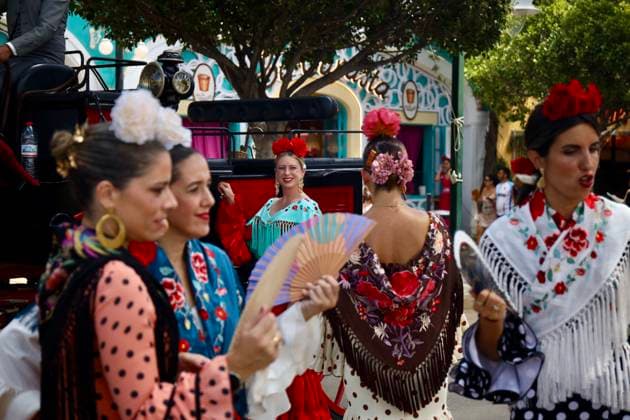 Scenes from the Málaga Fair: Several women dressed in flamenco outfits stroll through the Málaga Fair on August 19, 2026, in Málaga, Andalusia, Spain As they do every year, locals and visitors enjoy the Málaga Fair at the fairgrounds August 19, 2026, in Málaga, Andalusia, Málaga, Andalusia, Spain  Copyright: xÃlexxZeax 7721031