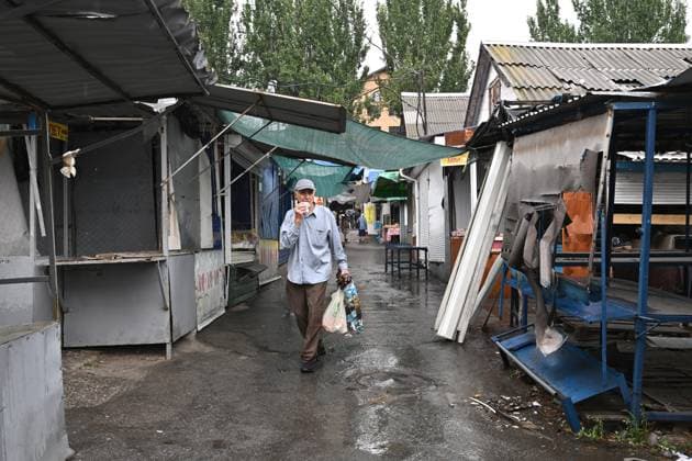 A man walks between stalls at the central market, damaged by a Russian attack, Zaporizhzhia, Ukraine, August 19, 2026. Overnight, the Russian army struck the south-eastern Ukrainian city with drones, destroying a hostel, a shopping centre, and the central market. (Photo by Dmytro Smolienko Ukrinform) Russian drones attack central market in Zaporizhzhia  Copyright: xDmytroxSmolienkox