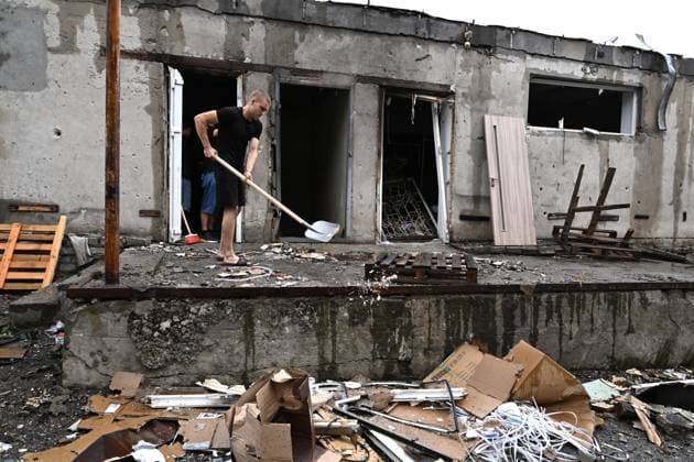 A man removes the rubble at the central market, damaged by a Russian attack, Zaporizhzhia, Ukraine, August 19, 2026. Overnight, the Russian army struck the south-eastern Ukrainian city with drones, destroying a hostel, a shopping centre, and the central market. (Photo by Dmytro Smolienko Ukrinform) Russian drones attack central market in Zaporizhzhia  Copyright: xDmytroxSmolienkox