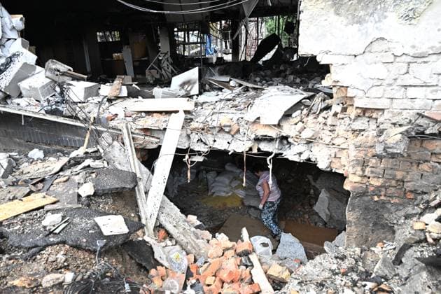 A woman examines goods in a warehouse at the central market, damaged by a Russian attack, Zaporizhzhia, Ukraine, August 19, 2026. Overnight, the Russian army struck the south-eastern Ukrainian city with drones, destroying a hostel, a shopping centre, and the central market. (Photo by Dmytro Smolienko Ukrinform) Russian drones attack central market in Zaporizhzhia  Copyright: xDmytroxSmolienkox