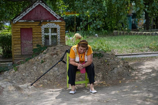 August 19, 2026, Serhiivka, Donetsk Oblast, Ukraine: A woman is sitting on a chair while waiting to be evacuated from the village of Serhiivka, east of Kramatorsk, in the Donbas region, Ukraine, on August 19, 2026. The White Angels crew, composed of police officers, evacuate people from the frontline towns and villages. Serhiivka Ukraine  - ZUMAa252 20260819_zip_a252_007 Copyright: xDavidxAllignonx