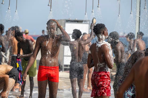 The humanitarian crisis in Ceuta continues. Several migrants shower on Trampolín Beach on August 19, 2026, in Ceuta, Spain. Ceuta continues to face a serious humanitarian crisis following the historic mass influx of more than 70,000 migrants who swam across the Tarajal on July 30 and 31. Although the current police deployment and border reinforcement by by Moroccan authorities have succeeded in curbing the influx, the autonomous city continues to face a serious humanitarian crisis, health, and security crises. AUGUST 19, 2026 CEUTA MIGRATION CRISIS MIGRANTS IMMIGRANTS SPRINGBOARD TARAJAL PIXELATED Ceuta Ceuta, Spain  Copyright: xMarcosxMorenox 7721164