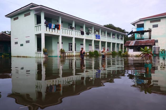 August 19, 2026, Ngathaingchaung, Ayeyarwady Division, Myanmar: Homes are submerged by floodwaters in Ngathaingchaung Township, Ayeyarwady Region..In Laymyethna Township, Ayeyarwady Region, the Ngawun River embankment collapsed on July 31, leaving nearby towns including Hinthada, Yegyi, Ngathaingchaung, Kyonpyaw and Kyaunggon still inundated, affecting tens of thousands of people, officials said. Ngathaingchaung Myanmar  - ZUMAn324 20260819_zip_n324_010 Copyright: xAyexMyaxNaingx