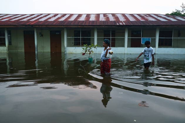 August 19, 2026, Ngathaingchaung, Ayeyarwady Division, Myanmar: Homes are submerged by floodwaters in Ngathaingchaung Township, Ayeyarwady Region..In Laymyethna Township, Ayeyarwady Region, the Ngawun River embankment collapsed on July 31, leaving nearby towns including Hinthada, Yegyi, Ngathaingchaung, Kyonpyaw and Kyaunggon still inundated, affecting tens of thousands of people, officials said. Ngathaingchaung Myanmar  - ZUMAn324 20260819_zip_n324_012 Copyright: xAyexMyaxNaingx