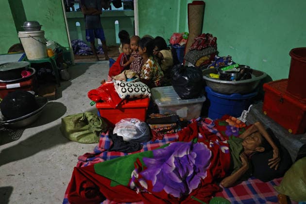 August 19, 2026, Ngathaingchaung, Ayeyarwady Division, Myanmar: Women and children, along with a few men, stay at a flood relief camp in Ngathaingchaung Township, Ayeyarwady Region..In Laymyethna Township, Ayeyarwady Region, the Ngawun River embankment collapsed on July 31, leaving nearby towns including Hinthada, Yegyi, Ngathaingchaung, Kyonpyaw and Kyaunggon still inundated, affecting tens of thousands of people, officials said. Ngathaingchaung Myanmar  - ZUMAn324 20260819_zip_n324_026 Copyright: xAyexMyaxNaingx