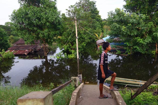 August 19, 2026, Ngathaingchaung, Ayeyarwady Division, Myanmar: Homes are submerged by floodwaters in Ngathaingchaung Township, Ayeyarwady Region..In Laymyethna Township, Ayeyarwady Region, the Ngawun River embankment collapsed on July 31, leaving nearby towns including Hinthada, Yegyi, Ngathaingchaung, Kyonpyaw and Kyaunggon still inundated, affecting tens of thousands of people, officials said. Ngathaingchaung Myanmar  - ZUMAn324 20260819_zip_n324_056 Copyright: xAyexMyaxNaingx