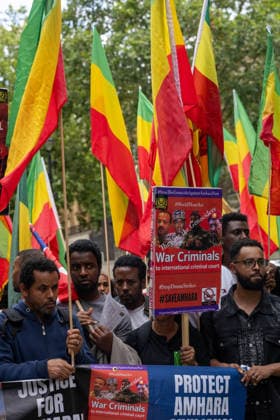Amhara Protesters Block Downing Street Entrance in London - 19 Aug 2026 Demonstrators hold placards reading War Criminals to International Criminal Court, Justice For... and Protect Amhara, alongside a poster captioned They Are the Genociders bearing hashtags including StopTheGenocideAgainstAmharaNow and StopDroneStrikes, during a march through central London. Members of the Amhara community held a protest against what they describe as an ongoing campaign of ethnic cleansing and genocide against the Amhara people by the Ethiopian government. The Amhara are one of Ethiopia s largest ethnic groups. Since armed conflict escalated between government forces and the Fano militia in the Amhara region in April 2023, rights groups and Amha Copyright: xIanxDavidsonx xSOPAxImagesx idavidson32583
