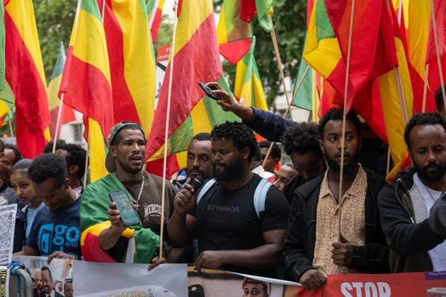 Amhara Protesters Block Downing Street Entrance in London - 19 Aug 2026 A man speaks as demonstrators carrying Ethiopian flags and placards, including one reading Stop Amhara , gather during the rally. Members of the Amhara community held a protest against what they describe as an ongoing campaign of ethnic cleansing and genocide against the Amhara people by the Ethiopian government. The Amhara are one of Ethiopia s largest ethnic groups. Since armed conflict escalated between government forces and the Fano militia in the Amhara region in April 2023, rights groups and Amhara diaspora organisations have accused Prime Minister Abiy Ahmed s government of mass killings, displacement and drone strikes against Amhara civilians, allegations the Copyright: xIanxDavidsonx xSOPAxImagesx idavidson32592