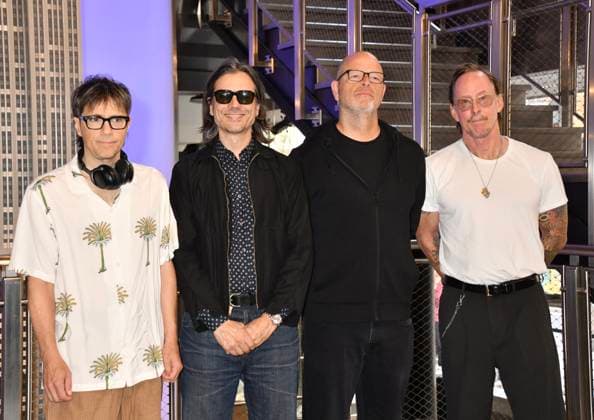 NEW YORK, NY - AUGUST 19: Weezer light the Empire State Building to Celebrate the Release of Weezer (The Gold Album) in Support of Hearts of Gold on August 19, 2026 in New York City. Copyright: xMediaPunchx