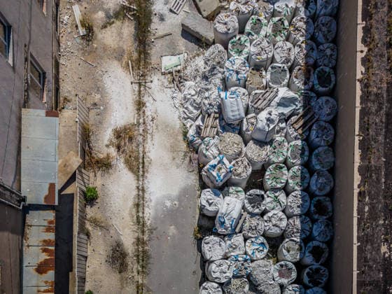 Aerial photo of Illegal hazardous waste disposal site in Gospic, Croatia Aerial photo of the illegal hazardous waste disposal site in Gospic, Croatia, on August 19, 2026. Approximately 37,000 tons of industrial and hazardous waste were illegally dumped at at an abandoned industrial complex in Gospic. Investigation details from Croatia s anti-corruption office, USKOK, outline massive environmental contamination and a network of institutional corruption.  ZvonimirxBarisin PIXSELL