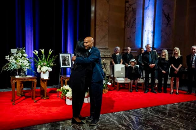 August 19, 2026, Montreal, Pq, CANADA: Richard Jones, son of pianist Oliver Jones, is embraced by Montreal mayor Soraya Martinez Ferrada during a ceremony for the late musician at MontrealöÄÃ s city hall, on Wednesday, Aug. 19, 2026. Montreal CANADA  - ZUMAc35_ 20260819_zaf_c35_067 Copyright: xChristopherxKatsarovx