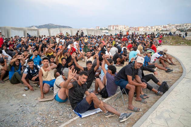 The humanitarian crisis in Ceuta continues. Several migrants on a beach, August 19, 2026, in Ceuta, Spain. Ceuta continues to face a serious humanitarian crisis following the historic mass influx of more than 70,000 migrants who swam across the Tarajal on July 30 and 31. Although the current police deployment and border reinforcement by by Moroccan authorities have succeeded in curbing the influx, the autonomous city continues to face a serious humanitarian crisis, health, and security crises. AUGUST 19, 2026 CEUTA MIGRATION CRISIS MIGRANTS IMMIGRANTS TRAMPOLÍN TARAJAL PLAYA BENÍTEZ Ceuta Ceuta, Spain  Copyright: xMarcosxMorenox 7721813