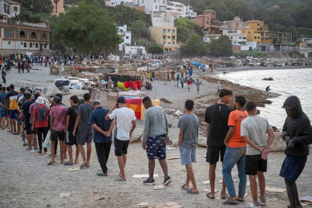 The humanitarian crisis in Ceuta continues. Several migrants on a beach, August 19, 2026, in Ceuta, Spain. Ceuta continues to face a serious humanitarian crisis following the historic mass influx of more than 70,000 migrants who swam across the Tarajal on July 30 and 31. Although the current police deployment and border reinforcement by by Moroccan authorities have succeeded in curbing the influx, the autonomous city continues to face a serious humanitarian crisis, health, and security crises. AUGUST 19, 2026 CEUTA MIGRATION CRISIS MIGRANTS IMMIGRANTS TRAMPOLÍN TARAJAL PLAYA BENÍTEZ Ceuta Ceuta, Spain  Copyright: xMarcosxMorenox 7721814