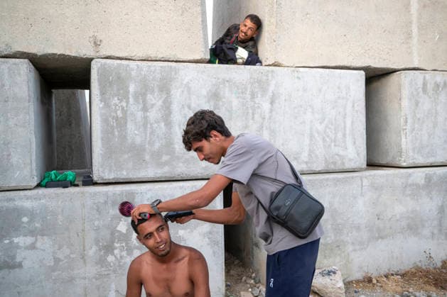The humanitarian crisis in Ceuta continues. Several migrants on a beach, August 19, 2026, in Ceuta, Spain. Ceuta continues to face a serious humanitarian crisis following the historic mass influx of more than 70,000 migrants who swam across the Tarajal on July 30 and 31. Although the current police deployment and border reinforcement by by Moroccan authorities have succeeded in curbing the influx, the autonomous city continues to face a serious humanitarian crisis, health, and security crises. AUGUST 19, 2026 CEUTA MIGRATION CRISIS MIGRANTS IMMIGRANTS TRAMPOLÍN TARAJAL PLAYA BENÍTEZ Ceuta Ceuta, Spain  Copyright: xMarcosxMorenox 7721835