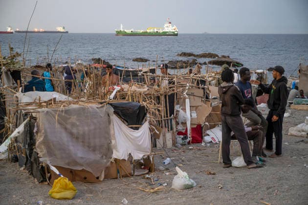 The humanitarian crisis in Ceuta continues. Several migrants on a beach, August 19, 2026, in Ceuta, Spain. Ceuta continues to face a serious humanitarian crisis following the historic mass influx of more than 70,000 migrants who swam across the Tarajal Strait on July 30 and 31. Although the current police deployment and border reinforcement by by Moroccan authorities have managed to stem the influx, the autonomous city continues to face a serious humanitarian crisis, health, and security crises. AUGUST 19, 2026 CEUTA MIGRATION CRISIS MIGRANTS IMMIGRANTS TRAMPOLÍN TARAJAL PLAYA BENÍTEZ Ceuta, Spain  Copyright: xMarcosxMorenox 7721819