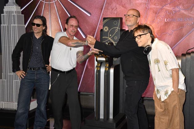 NEW YORK, NY - AUGUST 19: Weezer light the Empire State Building to Celebrate the Release of Weezer (The Gold Album) in Support of Hearts of Gold on August 19, 2026 in New York City. Copyright: xmpi099 MediaPunchx