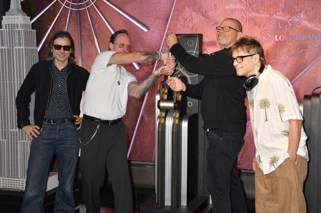 NEW YORK, NY - AUGUST 19: Weezer light the Empire State Building to Celebrate the Release of Weezer (The Gold Album) in Support of Hearts of Gold on August 19, 2026 in New York City. Copyright: xmpi099 MediaPunchx