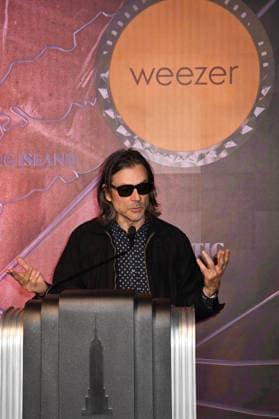 NEW YORK, NY - AUGUST 19: Weezer light the Empire State Building to Celebrate the Release of Weezer (The Gold Album) in Support of Hearts of Gold on August 19, 2026 in New York City. Copyright: xmpi099 MediaPunchx