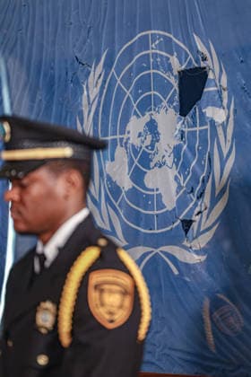 August 19, 2026, New York, New York, United States: United Nations Security Officer stands in front of the original UN flag from the Canal Hotel in Baghdad at UNHQ, in observance of World Humanitarian Day and the anniversary of the 19 August 2003 bombing of the UN headquarters at the Canal Hotel in Baghdad, Iraq. The attack killed 22 people, including UN Special Representative Sergio Vieira de Mello, and injured more than 150 others. World Humanitarian Day is observed annually on 19 August in remembrance of humanitarian workers killed and injured in the course of their work. New York United States - ZUMAo116 20260819_znp_o116_006 Copyright: xBiancaxOterox