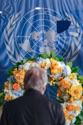 August 19, 2026, New York, New York, United States: Secretary-General ANTONIO GUTERRES stands before a memorial wreath and the original UN flag from the Canal Hotel in Baghdad during an observance of World Humanitarian Day at UNHQ. The flag bears holes and tears sustained during the 19 August 2003 bombing of the UN headquarters in Baghdad, Iraq, which killed 22 people and injured more than 150 others. New York United States - ZUMAo116 20260819_znp_o116_010 Copyright: xBiancaxOterox