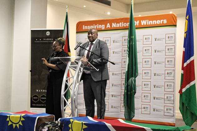 (260820) -- CAPE TOWN, Aug. 20, 2026 -- South African Minister of Sport, Arts and Culture Gayton McKenzie (R) speaks during a repatriation ceremony at the Iziko South African Museum in Cape Town, South Africa, Aug. 19, 2026. TO GO WITH South Africa returns ancestral remains to Namibia for colonial redress, healing (Photo by Xinhua) SOUTH AFRICA-CAPE TOWN-NAMIBIAN ANCESTRAL REMAINS-REPATRIATION CEREMONY ShakirahxThebus 