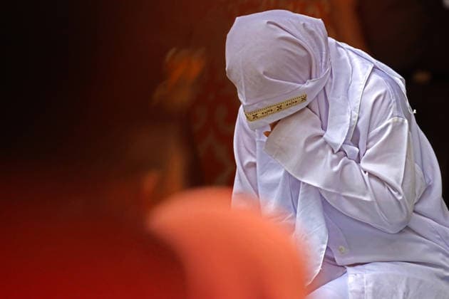 August 20, 2026, Banda Aceh, Aceh, Indonesia: A woman underwent a public caning in Taman Sari, Banda Aceh, Aceh Province, Indonesia, on Thursday, August 20, 2026. The Banda Aceh Sharia Court sentenced 11 people to between 7 and 100 lashes for violating Islamic Sharia. Banda Aceh Indonesia - ZUMAs340 20260820_zip_s340_003 Copyright: xKhairuxSyukrillahx