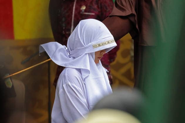 August 20, 2026, Banda Aceh, Aceh, Indonesia: A woman underwent a public caning in Taman Sari, Banda Aceh, Aceh Province, Indonesia, on Thursday, August 20, 2026. The Banda Aceh Sharia Court sentenced 11 people to between 7 and 100 lashes for violating Islamic Sharia. Banda Aceh Indonesia - ZUMAs340 20260820_zip_s340_004 Copyright: xKhairuxSyukrillahx