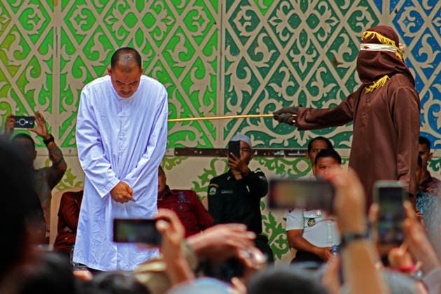 August 20, 2026, Banda Aceh, Aceh, Indonesia: A man endured pain while undergoing a public caning in Taman Sari, Banda Aceh, Aceh Province, Indonesia, on Thursday, August 20, 2026. The Banda Aceh Sharia Court sentenced 11 people to between 7 and 100 lashes for violating Islamic Sharia. Banda Aceh Indonesia - ZUMAs340 20260820_zip_s340_006 Copyright: xKhairuxSyukrillahx