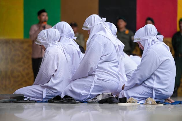 August 20, 2026, Banda Aceh, Aceh, Indonesia: Convicts found guilty of violating Sharia law listened to a religious sermon before undergoing public caning at Bustanul Salatin Park in Banda Aceh, Aceh Province, Indonesia, on Thursday. Eleven individuals were publicly caned for various offensesÃ¢â‚¬including gambling, being alone with a non-marital partner, and adulteryÃ¢â‚¬receiving punishments ranging from 7 to 100 lashes. Banda Aceh Indonesia  - ZUMAi115 20260820_zip_i115_004 Copyright: xMuhammadxIqbalx