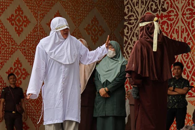 August 20, 2026, Banda Aceh, Aceh, Indonesia: A woman underwent a public caning in Taman Sari, Banda Aceh, Aceh Province, Indonesia, on Thursday, August 20, 2026. The Banda Aceh Sharia Court sentenced 11 people to between 7 and 100 lashes for violating Islamic Sharia. Banda Aceh Indonesia - ZUMAs340 20260820_zip_s340_010 Copyright: xKhairuxSyukrillahx
