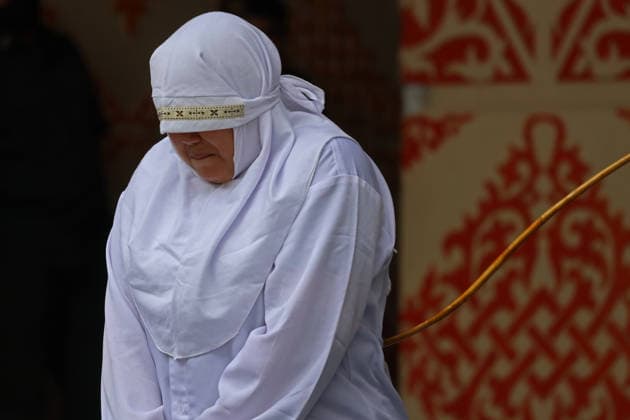 August 20, 2026, Banda Aceh, Aceh, Indonesia: A woman underwent a public caning in Taman Sari, Banda Aceh, Aceh Province, Indonesia, on Thursday, August 20, 2026. The Banda Aceh Sharia Court sentenced 11 people to between 7 and 100 lashes for violating Islamic Sharia. Banda Aceh Indonesia - ZUMAs340 20260820_zip_s340_014 Copyright: xKhairuxSyukrillahx