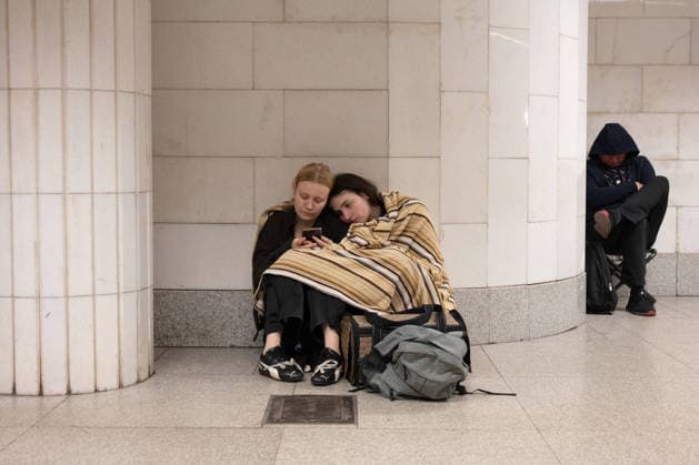 Two women look at a smartphone at the Holosiivska metro station during a large-scale overnight Russian attack on Kyiv, Ukraine, August 20, 2026. (Photo by Danylo Antoniuk Ukrinform) Kyiv residents shelter in metro during overnight Russian attack  Copyright: xDanyloxAntoniukx