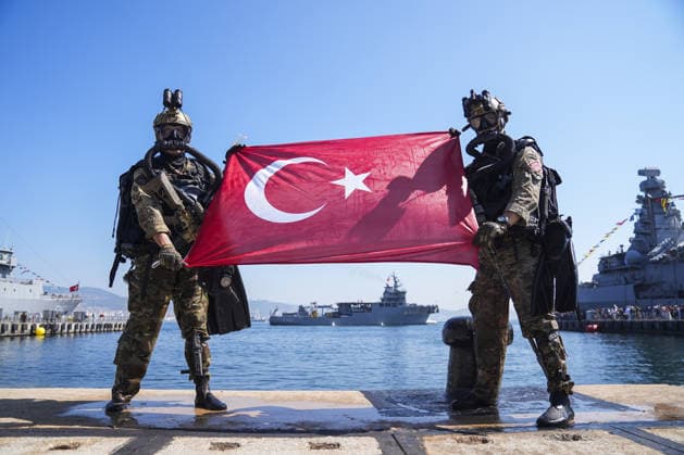 TEKNOFEST Blue Homeland KOCAELI, TURKIYE - AUGUST 20: A Turkish flag is unfurled as military demonstrations are held by the Underwater Offense (SAT) and Underwater Defense (SAS) Commands as part of the TEKNOFEST Blue Homeland at the Golcuk Naval Shipyard Command in Kocaeli, Turkiye, on August 20, 2026. Organized under the main leadership of the Turkish National Defense Ministry and the Turkish Technology Team Foundation (T3 Foundation), with Anadolu as the Global Communication Partner, the event showcases Turkiye s maritime power, defense capabilities, and indigenous technologies. Gathering technology and defense industry enthusiasts around a maritime focus, the festival will welcome visitors through August 23. Arife Karakum Anadolu Kocae  Copyright: x2026xAnadoluxArifexKarakumx