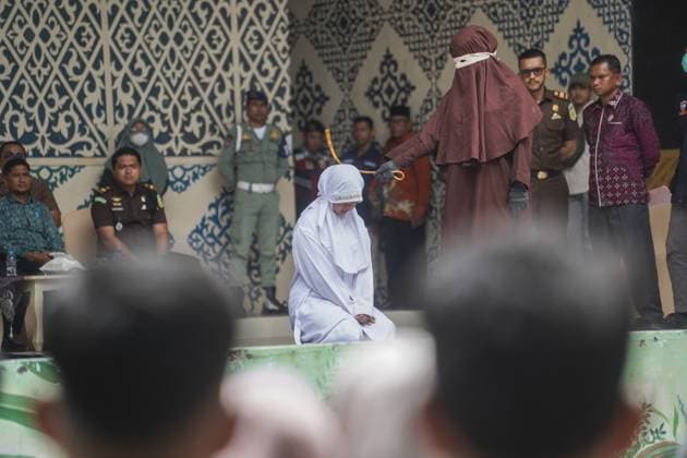 August 20, 2026, Banda Aceh, Indonesia: BANDA ACEH, ACEH, INDONESIA, AUGUST 20, 2026: Eleven people convicted under Aceh s Qanun on Islamic Criminal Law (Jinayat) receive caning sentences at the Taman Sari Bustanussalatin Stage in Banda Aceh. The sentences are carried out in public as part of the court-ordered punishment. Banda Aceh Indonesia - ZUMAq101 20260820_zna_q101_027 Copyright: xCyehx